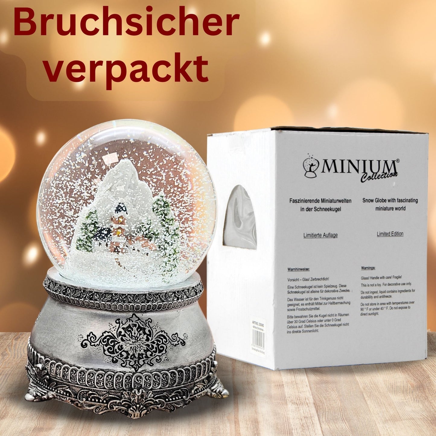 Nostalgische Schneekugel Alpendorf auf Zinnsockel verziehrt 100 mm Durchmesser mit Spieluhr - Schneekugelhaus