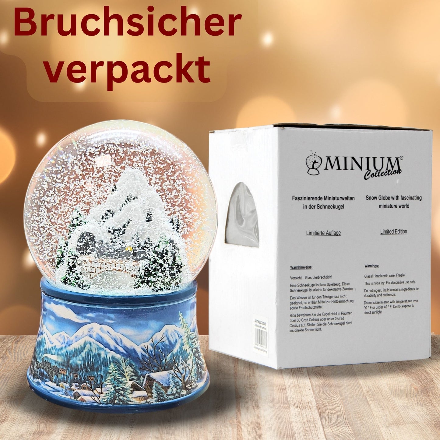 Nostalgische Schneekugel Berglandschaft mit Brücke auf Sockel Winterlandschaft hellblau 100 mm Durchmesser mit Spieluhr - Schneekugelhaus