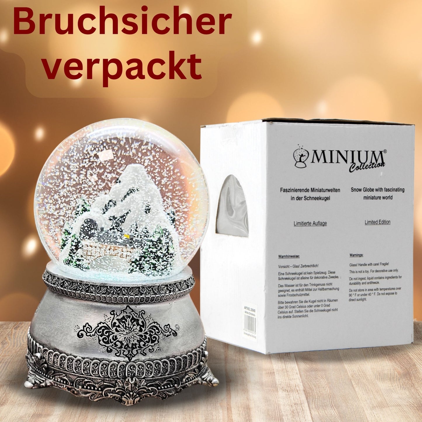 Nostalgische Schneekugel Berglandschaft mit Brücke auf Zinnsockel 100 mm Durchmesser mit Spieluhr - Schneekugelhaus