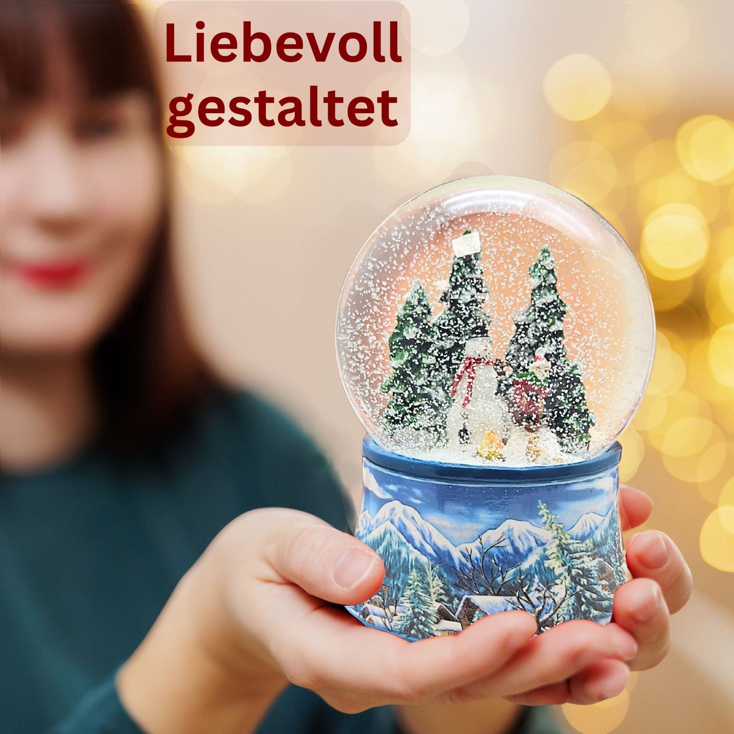 Schneekugel Schneemann mit Kind auf Schlitten mit Spieluhr 10 cm Durchmesser - Schneekugelhaus