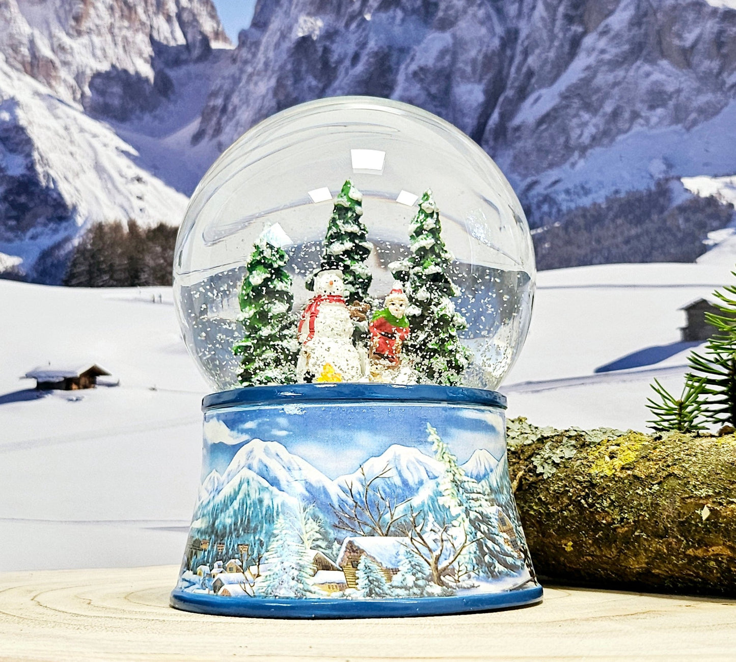 Schneekugel Schneemann mit Kind auf Schlitten mit Spieluhr 10 cm Durchmesser - Schneekugelhaus