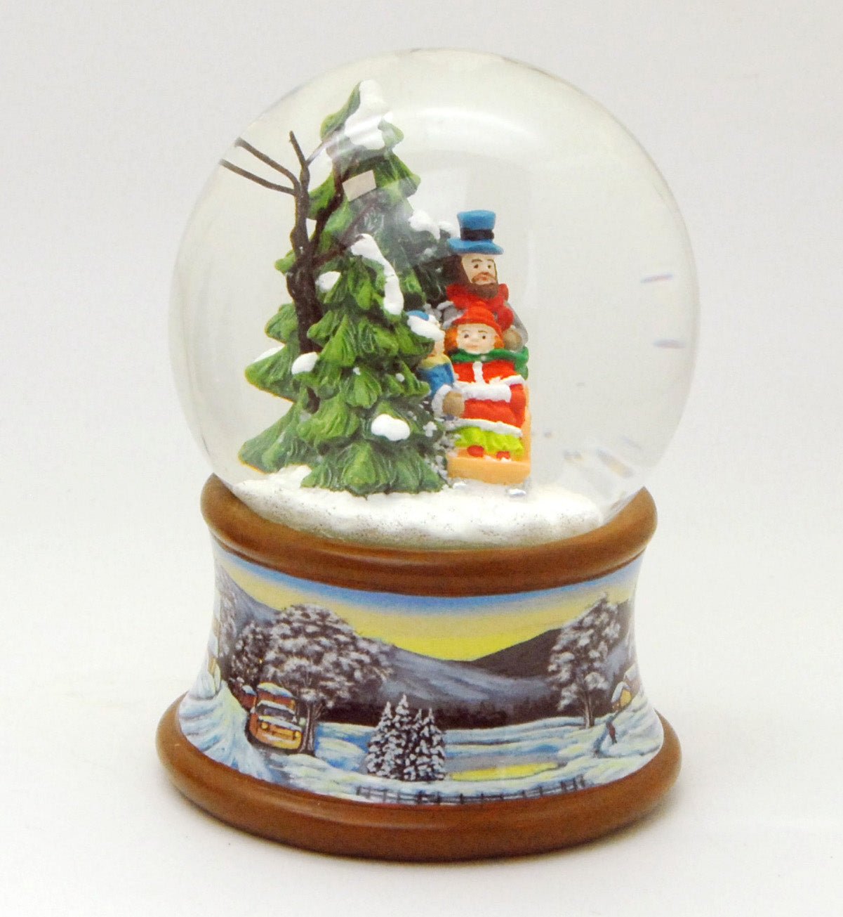 Schneekugel Familie mit Schlitten im Winterwald auf Sockel Winterlandschaft braun mit Spieluhr - Schneekugelhaus