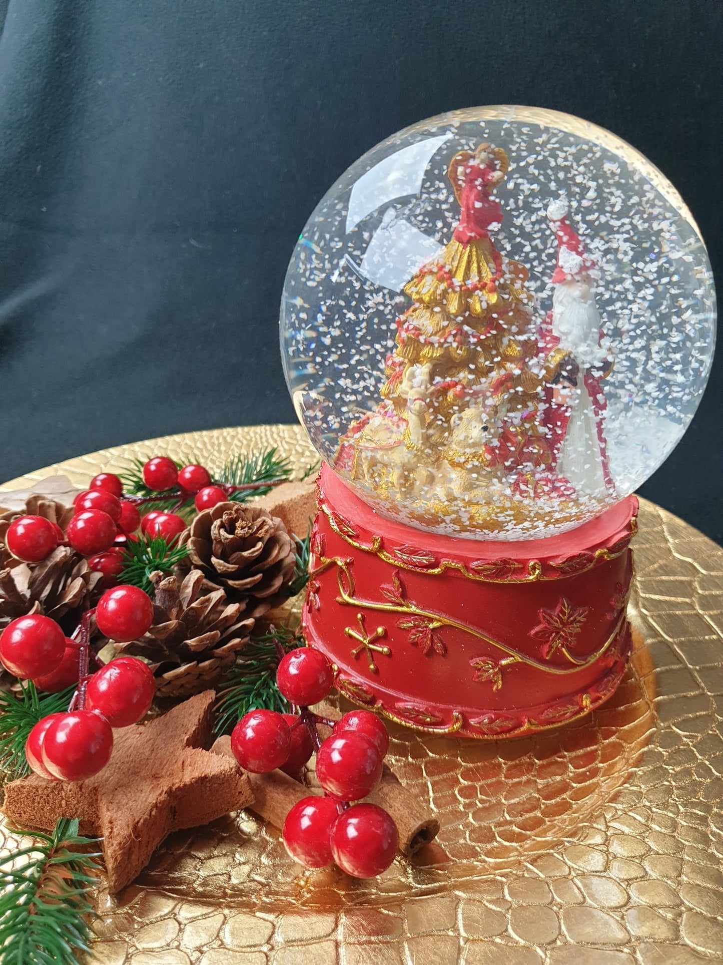 Schneekugel Weihnachtsmann mit Spieluhr rot groß - Schneekugelhaus