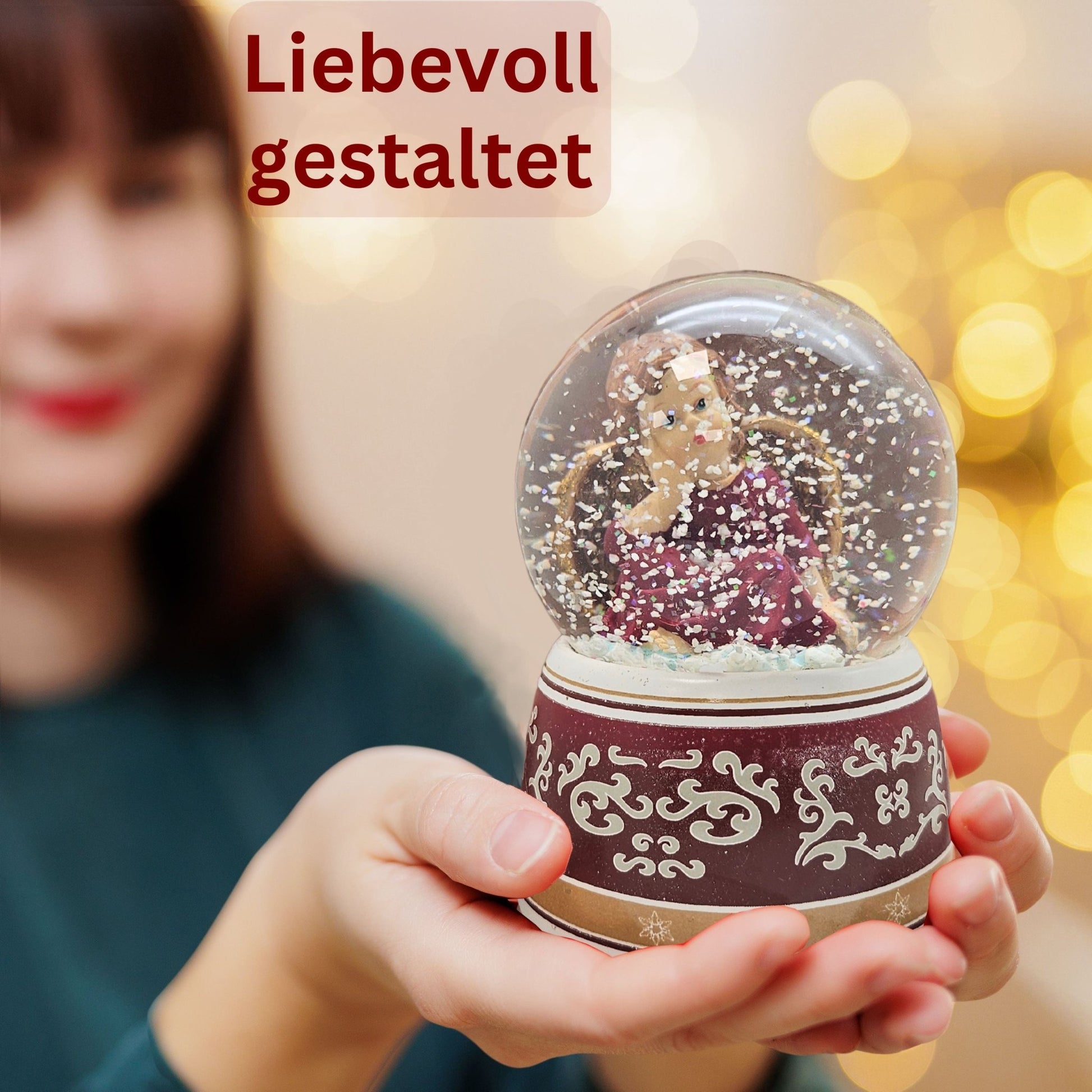 Schneekugel Engel rot mit Spieluhr 100 mm Durchmesser - Schneekugelhaus
