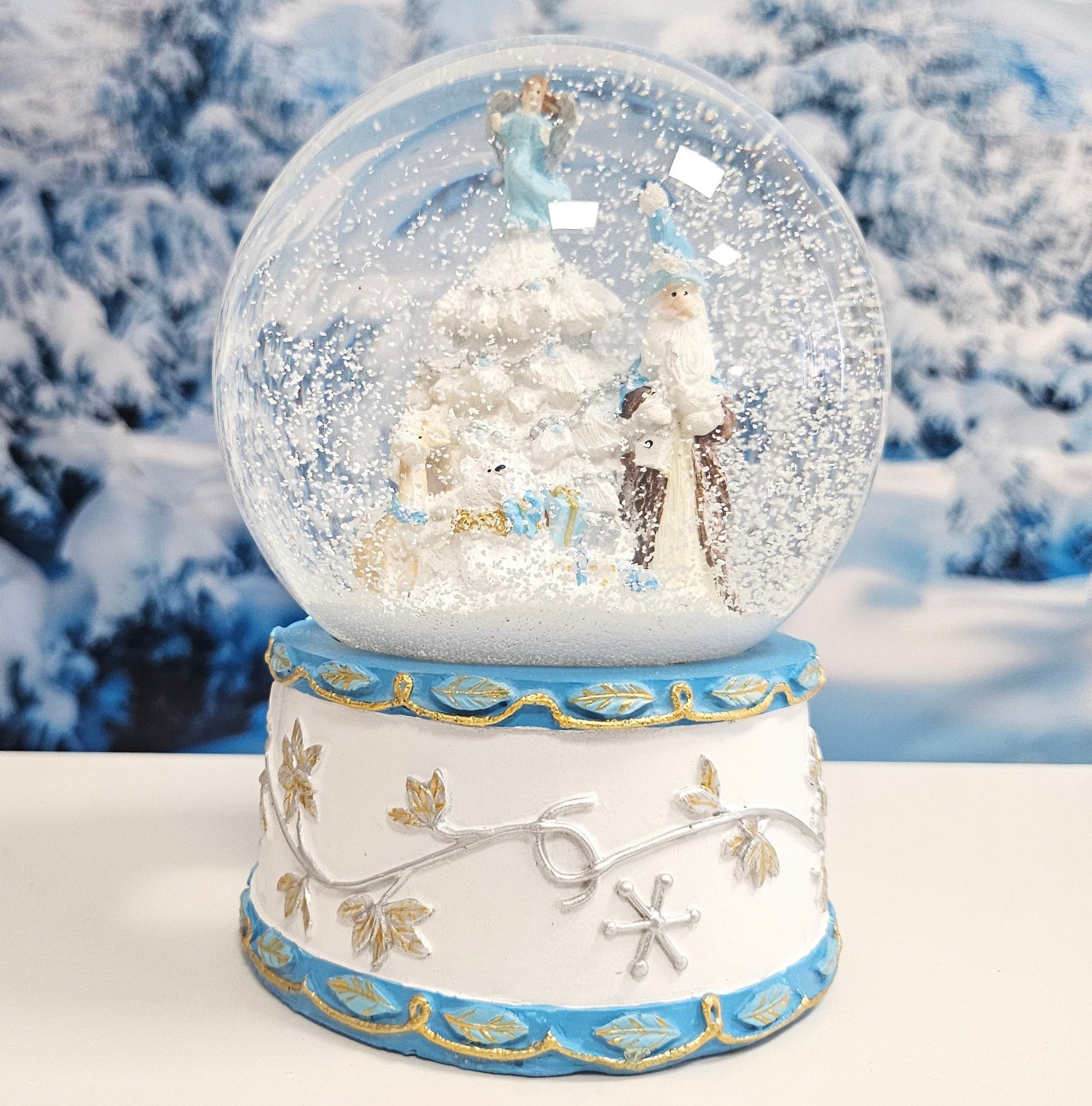 Schneekugel Weihnachtsmann mit Spieluhr, blau silber - 120 mm Durchmesser - Schneekugelhaus