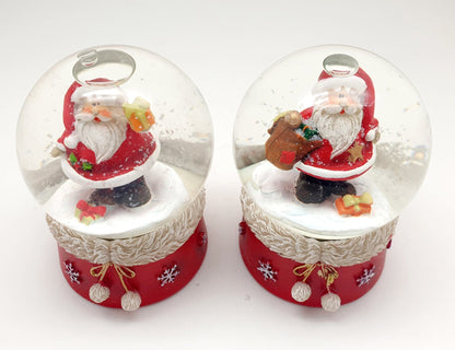 2er Set süße Schneekugeln Weihnachtsmann auf Pelzsockel Sack und Geschenk Durchmesser 65mm Luftblase - Schneekugelhaus