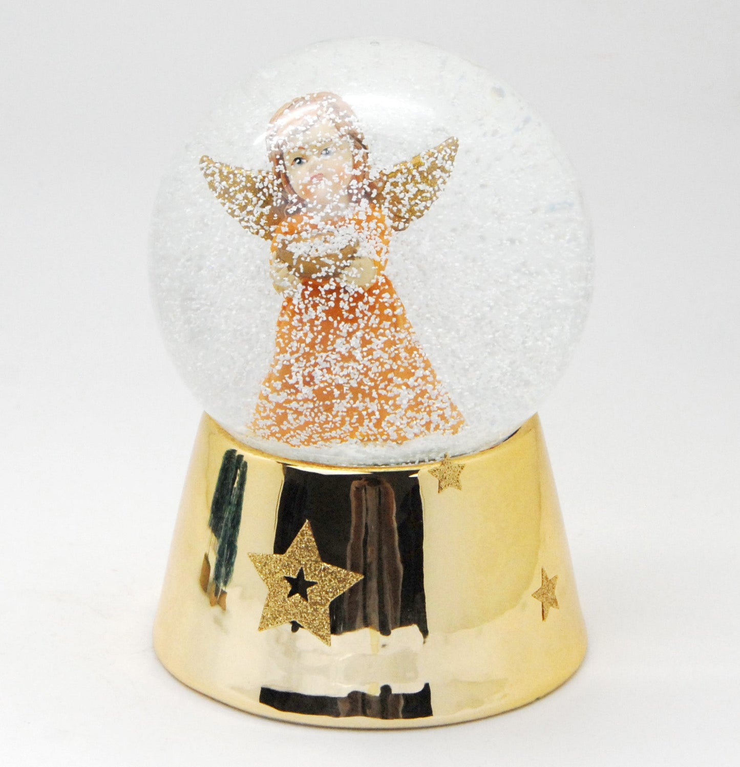 Schneekugel Engel orange mit Schale gold auf Sockel gold mit Sternen mit Spieluhr - Schneekugelhaus