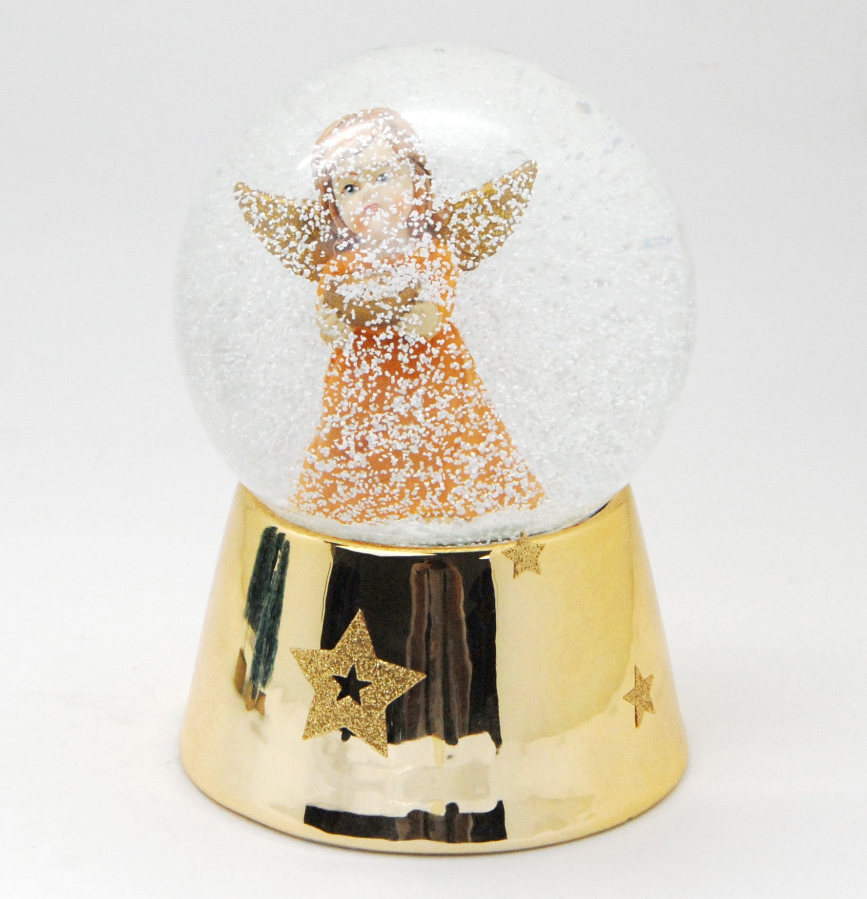Schneekugel Engel orange mit Schale gold auf Sockel gold mit Sternen mit Spieluhr - Schneekugelhaus