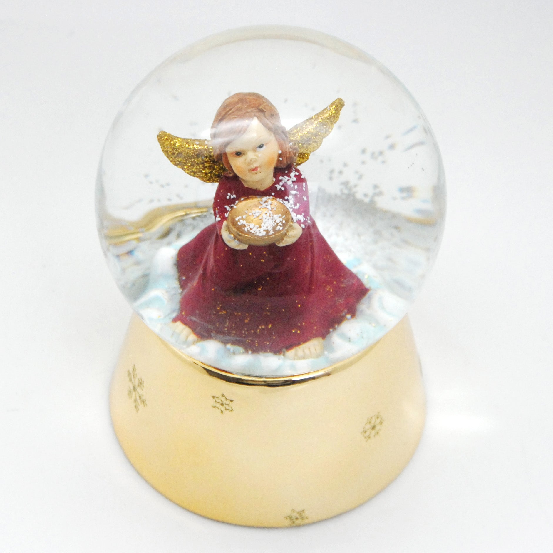 Schneekugel Engel rot mit Schale gold auf Sockel gold mit Sternen mit Spieluhr - Schneekugelhaus