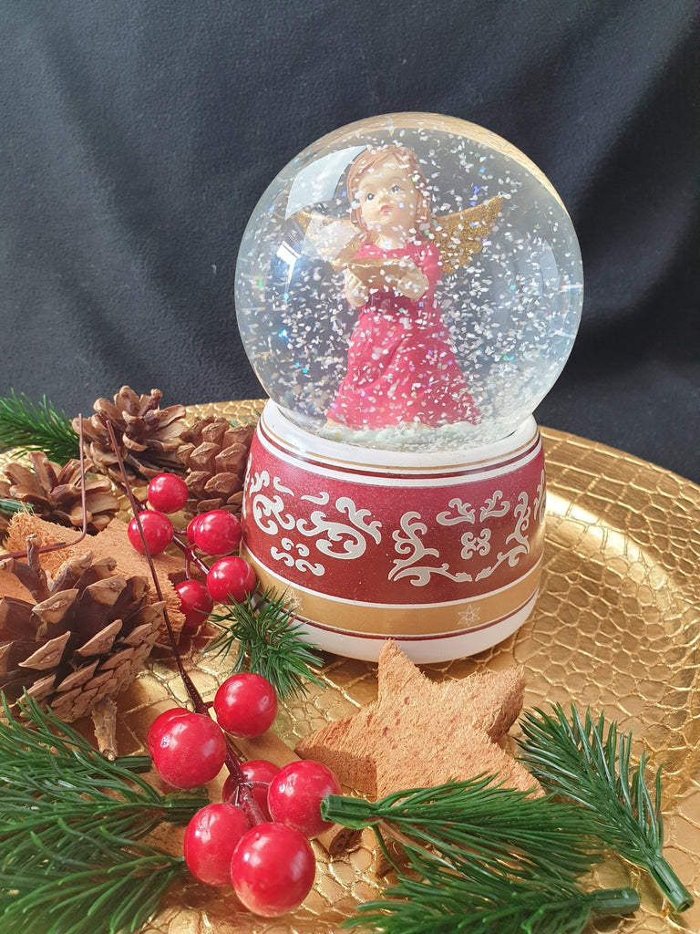 Schneekugel Engel rot mit Schale mit Spieluhr - Schneekugelhaus